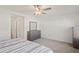 Well-lit bedroom with built-in dresser and mirror at 8239 Crescent Oaks Dr, New Port Richey, FL 34655