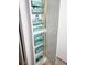 Bathroom cabinet with built-in shelves and mirrored doors at 9950 47Th N Ave # 104, St Petersburg, FL 33708
