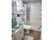 Updated bathroom with a glass vanity and tub shower combo at 9950 47Th N Ave # 104, St Petersburg, FL 33708