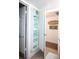 Bathroom with mirrored storage cabinet and decorative wall art at 9950 47Th N Ave # 104, St Petersburg, FL 33708