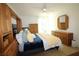 King-size bed, built-in cabinets, and plenty of natural light at 9950 47Th N Ave # 104, St Petersburg, FL 33708