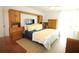 Bright bedroom with a king-size bed and built-in wooden cabinets at 9950 47Th N Ave # 104, St Petersburg, FL 33708
