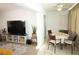 Casual dining area with a table and chairs, adjacent to the living room at 9950 47Th N Ave # 104, St Petersburg, FL 33708