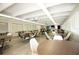 Spacious dining room with multiple tables and chairs at 9950 47Th N Ave # 104, St Petersburg, FL 33708