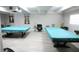 Game room featuring two pool tables and comfortable seating at 9950 47Th N Ave # 104, St Petersburg, FL 33708