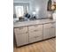 Modern kitchen featuring granite countertops and updated cabinets at 9950 47Th N Ave # 104, St Petersburg, FL 33708