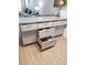 Modern kitchen island with ample storage and granite countertop at 9950 47Th N Ave # 104, St Petersburg, FL 33708