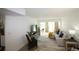 Bright living room with comfy seating and access to a patio at 9950 47Th N Ave # 104, St Petersburg, FL 33708