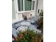Relaxing patio with seating and decorative rug at 9950 47Th N Ave # 104, St Petersburg, FL 33708