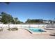 Community swimming pool with lounge chairs at 9950 47Th N Ave # 104, St Petersburg, FL 33708