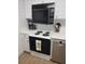 Electric range and oven with microwave above at 9950 47Th N Ave # 104, St Petersburg, FL 33708