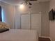 Bedroom with ceiling fan, large closet, and window at 11482 104Th St, Largo, FL 33773