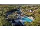 Aerial view of community pool, tennis courts, and homes at 11927 Middlebury Dr, Tampa, FL 33626