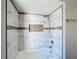 Bathroom with a shower/tub combo and marble tile at 12345 Yellow Rose Cir, Riverview, FL 33569