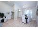 Bright dining room with hardwood floors and modern light fixture at 12809 Wallingford Dr, Tampa, FL 33624