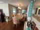 Bright dining room with a large table and chairs, hardwood floors, and decorative wall art at 13225 101St St # 425, Largo, FL 33773