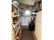 Laundry room with washer, dryer, and storage shelves at 13225 101St St # 425, Largo, FL 33773