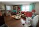 Spacious living room showcasing a comfortable seating arrangement, wood-look floors, and large windows at 13225 101St St # 425, Largo, FL 33773