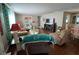 Inviting living room featuring a cozy seating area, hardwood floors, and a large TV at 13225 101St St # 425, Largo, FL 33773
