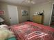 Comfortable main bedroom featuring a king-size bed, dresser, and soothing decor at 13225 101St St # 425, Largo, FL 33773