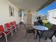 Covered patio with table, chairs, and grill at 13225 101St St # 425, Largo, FL 33773