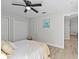 Bedroom with ceiling fan and access to another room at 15267 Valarie Ct, Brooksville, FL 34613