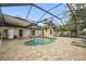 Beautiful kidney-shaped pool with screened enclosure at 16110 N 15Th St, Lutz, FL 33549