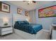 Serene bedroom with a comfy bed, nightstands, and tasteful artwork at 16819 Shell Bay Dr, Land O Lakes, FL 34638