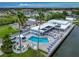 Aerial view of community clubhouse, pool, and waterway at 18675 Us Highway 19 N # 232, Clearwater, FL 33764