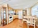 Galley kitchen with white appliances and wood cabinets at 18675 Us Highway 19 N # 232, Clearwater, FL 33764