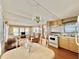 Bright living room features a dining area, comfy seating, and a chandelier at 18675 Us Highway 19 N # 232, Clearwater, FL 33764