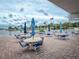 Community patio with tables and umbrellas at 18675 Us Highway 19 N # 232, Clearwater, FL 33764