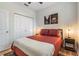 Bright bedroom with a queen bed, closet, and wood-look floors at 1910 W Union St, Tampa, FL 33607