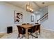 Bright dining room with a wooden table and six black chairs at 19388 Great Intention Way, Lutz, FL 33558