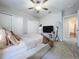 Spacious bedroom with TV and double closets at 21590 Violet Periwinkle Dr, Land O Lakes, FL 34637