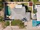 Aerial view of home with pool and yard at 230 144Th Ave, Madeira Beach, FL 33708