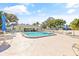 Refreshing pool with lounge chairs and patio tables at 2465 Northside Dr # 205, Clearwater, FL 33761