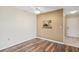 Dining area with wood-look flooring and view into kitchen at 2465 Northside Dr # 205, Clearwater, FL 33761