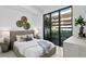 Bright bedroom with a comfortable bed and plenty of natural light at 3020 W Santiago St # 5, Tampa, FL 33629
