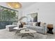 Spacious living room featuring a comfortable sectional sofa and stylish coffee tables at 3020 W Santiago St # 5, Tampa, FL 33629