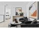 Modern sitting area with two armchairs and a marble-top coffee table at 3020 W Santiago St # 5, Tampa, FL 33629
