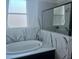 Spa-like bathroom featuring a soaking tub and walk-in shower at 4015 Woodacre Ln, Tampa, FL 33624