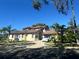 Two-story house with a Tesla in the driveway and a large yard at 4015 Woodacre Ln, Tampa, FL 33624