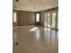 Spacious living room featuring tile floors and lots of natural light at 4015 Woodacre Ln, Tampa, FL 33624
