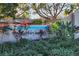 Attractive community entrance with lush landscaping and signage at 4542 Park Lake N Ter # 4542, Bradenton, FL 34209