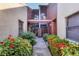 Shared condo entry with lush landscaping and a walkway leading to the building entrance at 4542 Park Lake N Ter # 4542, Bradenton, FL 34209