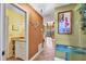 Condo entryway with powder room, tiled floor, and view into living room at 4542 Park Lake N Ter # 4542, Bradenton, FL 34209
