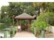 Serene lakeside gazebo with wooden dock at 4542 Park Lake N Ter # 4542, Bradenton, FL 34209
