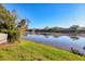 Serene lake view with lush landscaping and community features at 4542 Park Lake N Ter # 4542, Bradenton, FL 34209