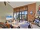 Living room with sliding glass doors, leather couches, and a view of the patio at 4542 Park Lake N Ter # 4542, Bradenton, FL 34209